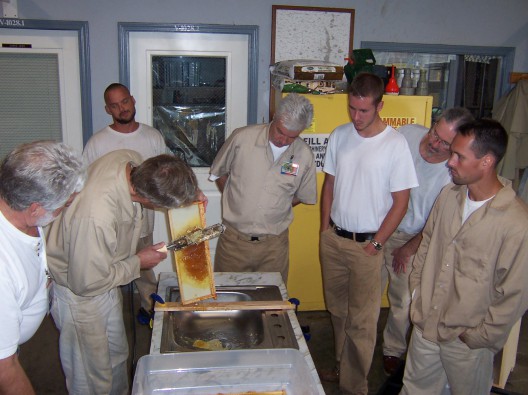 After collecting honey from the prison's beehives, Stafford Creek offenders learn how to create products such as lip balm and hand lotion. Photo: Doug Raines.