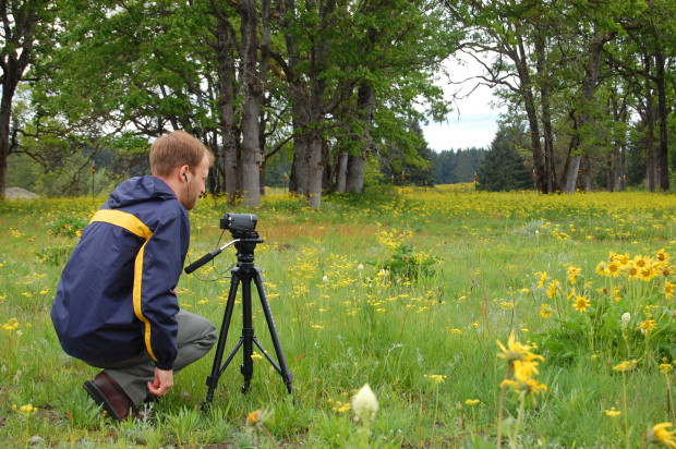 WDOC Videographer William C. Mader shoots in an oak woodland prairie. Photo by Jaal Mann.