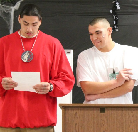 Two Roots graduates read a speech by Chief Seattle to the class. Photo by Joslyn Rose Trivett.