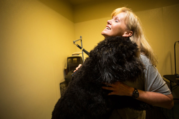 A dog trainer in the Prison Pet Partnership at Washington Corrections Center for Women shares a blissful moment with her trainee. Photo by Benj Drummond and Sara Joy Steel. 