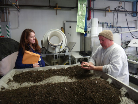 Nick Hacheney, lead worm farmer at Monroe Correctional Complex, discusses methods with SPP Program Manager, Kelli Bush. The worm farm is amazingly clean and sweet-smelling; it only smells of food waste for a few hours a week, right after it has been put into the vermicomposting bins. Photo by Joslyn Rose Trivett.