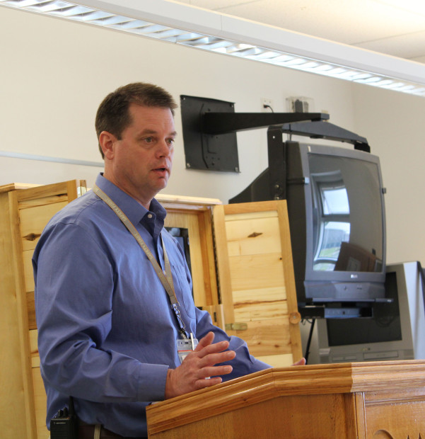 Chris Idso speaks about his environmental philosophy to a graduating class of Roots of Success. Photo by Joslyn Trivett.