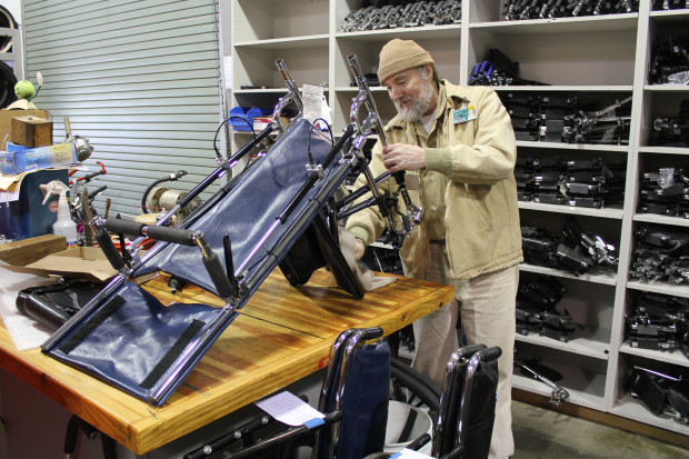 A technician refurbishes wheelchairs for donation to a recipient on the other side of the world. Photo by Joslyn Rose Trivett.