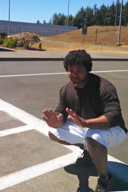 The author poses in the parking lot of Stafford Creek Corrections Center. 