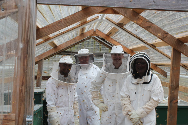 Staff and offender beekeepers take a break to pose for the camera. Photo by SPP.