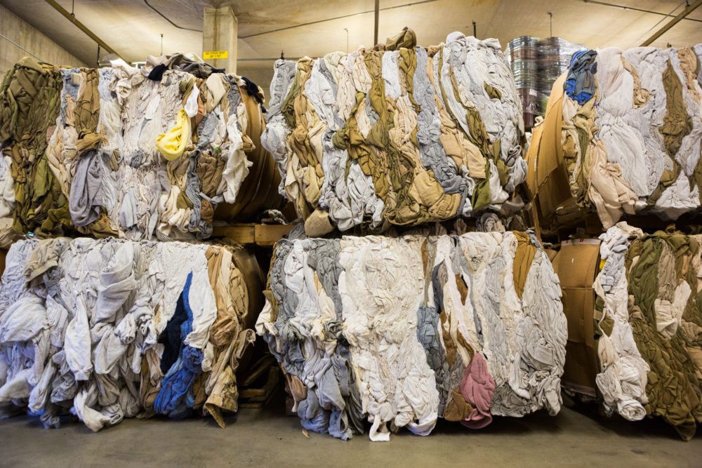 Unusable clothes from prisons across the State are brought to Washington Corrections Center to be sorted and bailed. The clothing is sent to a company that turns it into insulation. Photo by Benj Drummond and Sara Joy Steele.