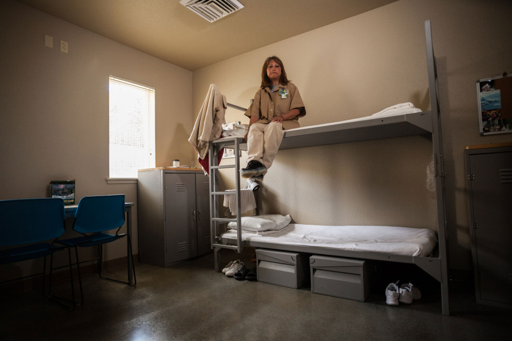 A technician for SPP's Taylor's checkerspot butterfly program sits on her bunk at Mission Creek Corrections Center. Photo by Benj Drummond and Sara Joy Steele.  
