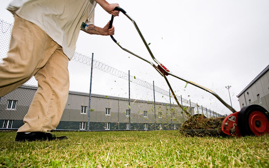 Motorless lawn mowing is a popular form of exercise at the Stafford Creek Corrections Center. <span class="copyright">© <a href="http://bdsjs.com/">Benjamin Drummond</a></span>