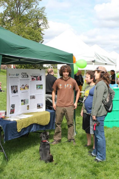 SPP intern Jaal Mann sharing the information at our booth with interested animal lovers at Save the Frogs Day 5K in Seward Park.
