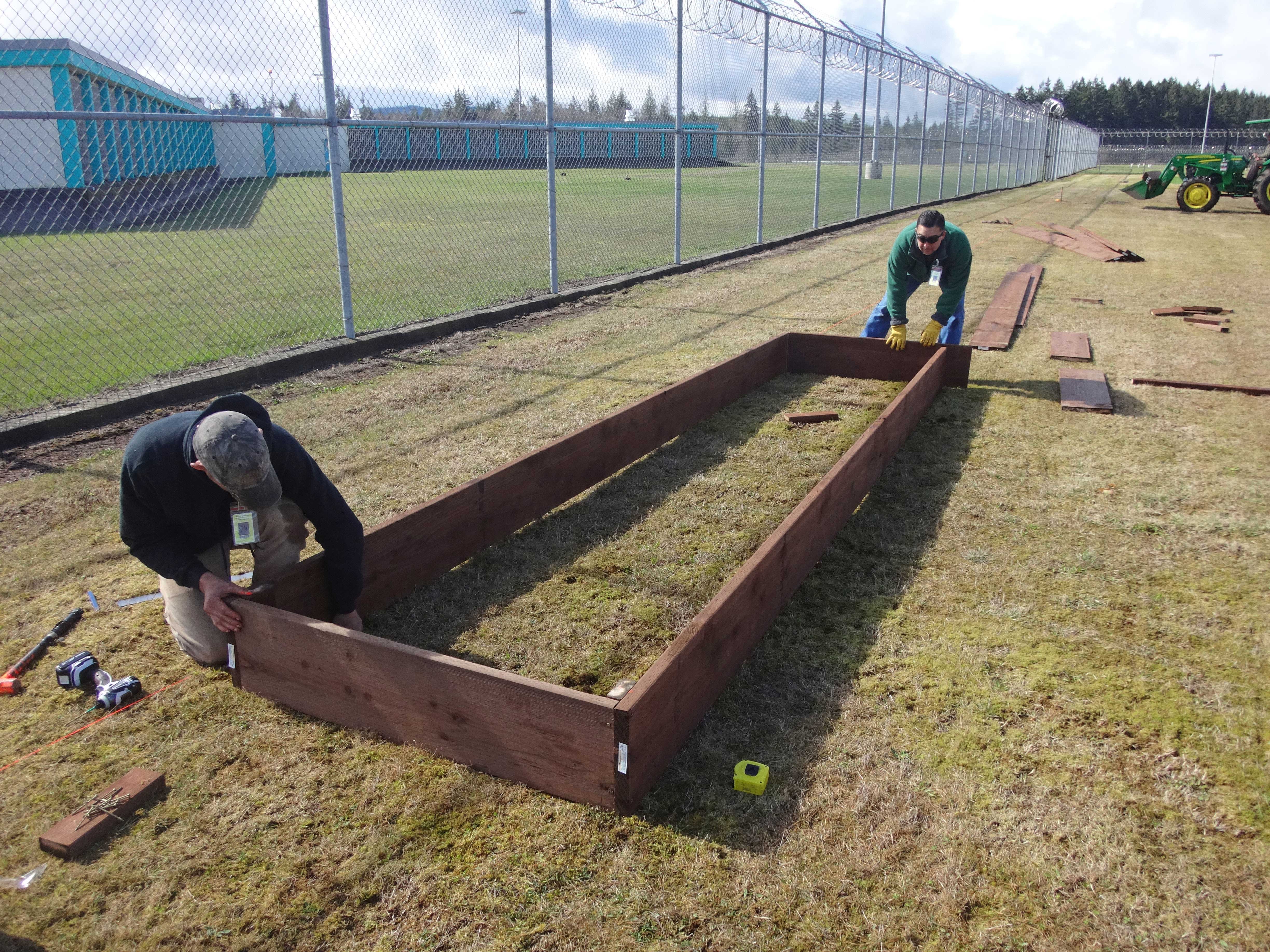 Scott and Tom build one of the first beds.